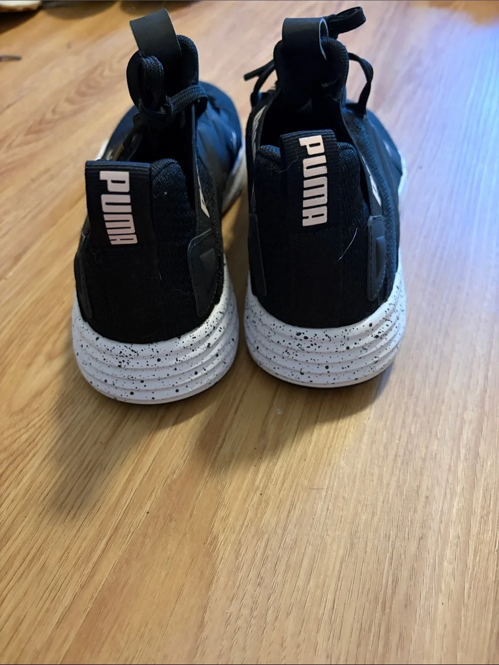 Puma women’s Black Athletic Sneakers with White Accent